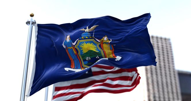the flag of the US state of New York waving in the wind with the American flag blurred in the background. New York State was admitted to the Union on July 26, 1788 as 11th state
