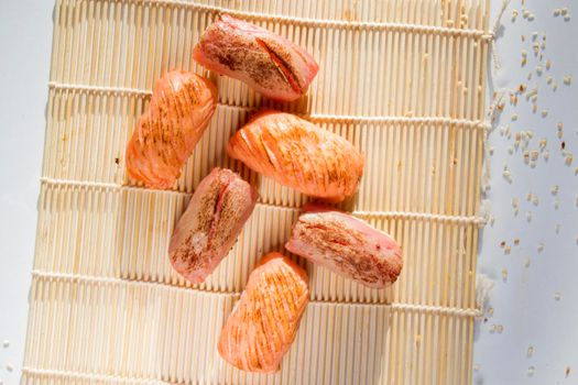Salmon and tuna fish nigiri set on the white background, sushi set