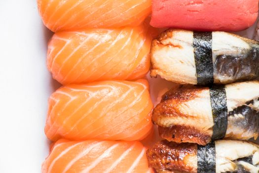 Eel fish, tuna and salmon nigiri set on the white background, nigiri sushi