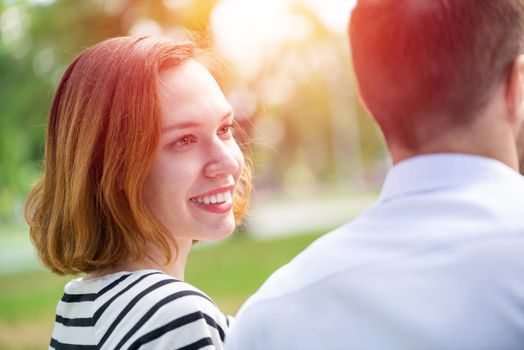 Portrait of a young attractive woman on a date in a park. Spending time with loved ones