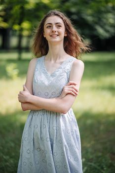 Portrait of a young smiling girl in the park