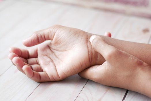 man suffering pain in hand close up .