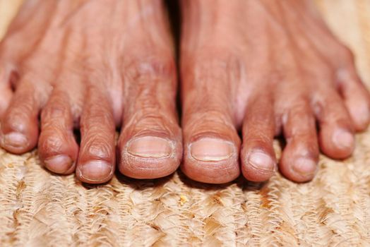 top view of senior women feet on floor