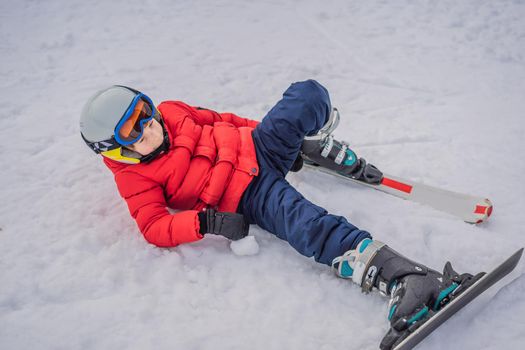 Child skiing in mountains. Active toddler kid with safety helmet, goggles and poles. Ski race for young children. Winter sport for family. Kids ski lesson in alpine school. Little skier racing in snow.