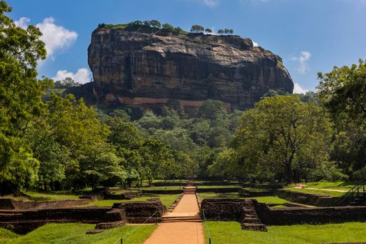 Sri Lanka. Sigiriya Dambulla. The most famous attraction - Lion Rock. View of the mountain from the park on a clear sunny day. High quality photo