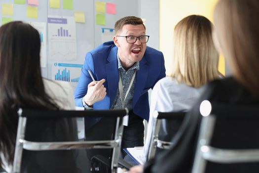 Portrait of serious man scream on training session, passionate speech with bright emotions. Training for company workers, skills development, class concept