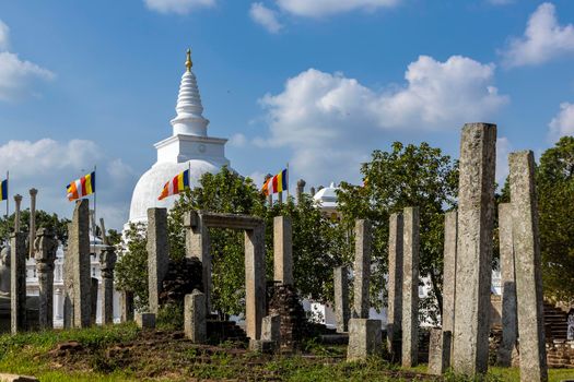 Sri Lanka. Anuradhapura. Thuparamaya Stupa is the earliest Dagoba to be constructed in the island. Shooting through ancient columns. High quality photo