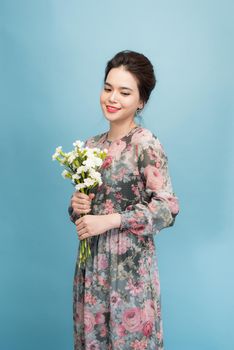 Lovely girl holds flowers bouquet