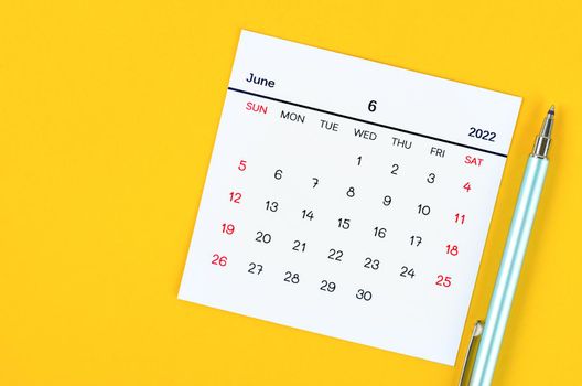The June 2022 calendar on yellow background.