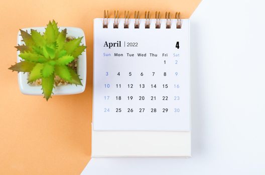 The April 2022 desk calendar with tree pot.