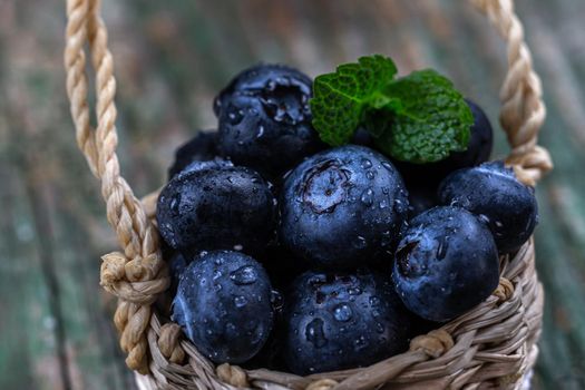 Blueberry berries in macro in a small pannier