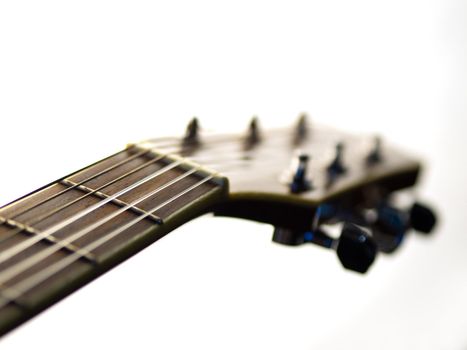 six - string acoustic guitar on a white background. music day