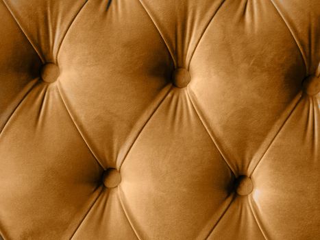 Velour lime surface of sofa close-up. Training equipment-velour mats tightened with buttons. brown chesterfield style quilted upholstery background