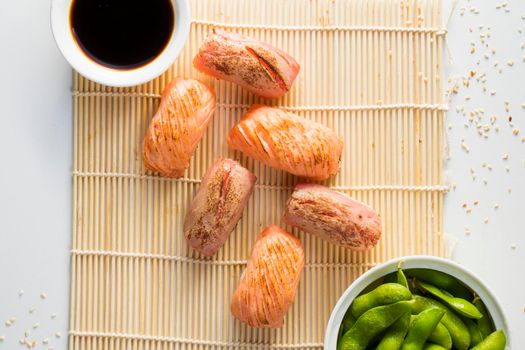 Salmon and tuna fish nigiri set on the white background, sushi set