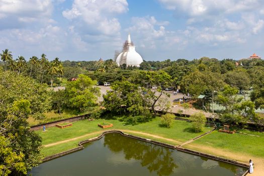 The Ruwanweli Maha Seya, also known as the Mahathupa (the Great Thupa) is a stupa in Anuradhapura, Sri Lanka. Popular attraction. View from Isurumuniya Buddhist temple. High quality photo