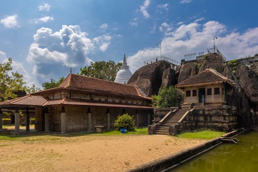 Sri Lanka. Anuradhapura. Isurumuniya Buddhist temple (Isurumuniya Rajamaha Viharaya). A popular attraction. View from the pond on a clear sunny day. High quality photo