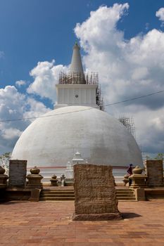 The Ruwanweli Maha Seya, also known as the Mahathupa (the Great Thupa) is a stupa in Anuradhapura, Sri Lanka. Popular attraction. Front view on a clear sunny day. High quality photo