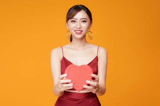 Portrait of Beautiful woman with red heart shaped box