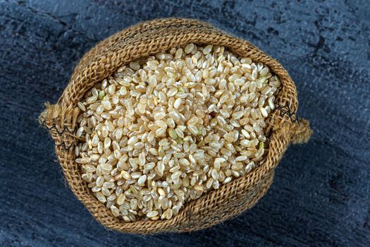 Round rice in a burlap pouch - Top view