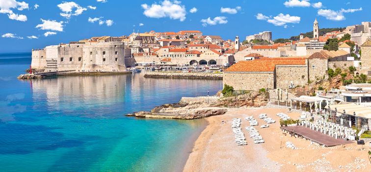 Dubrovnik. Banje beach and historic walls of Dubrovnik panoramic view, famous destination in Dalmatia region of Croatia