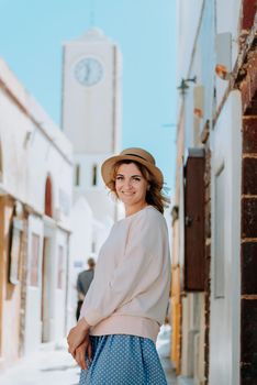 Tourist caucasian girl walking by old town. Boho girl walking on the city street