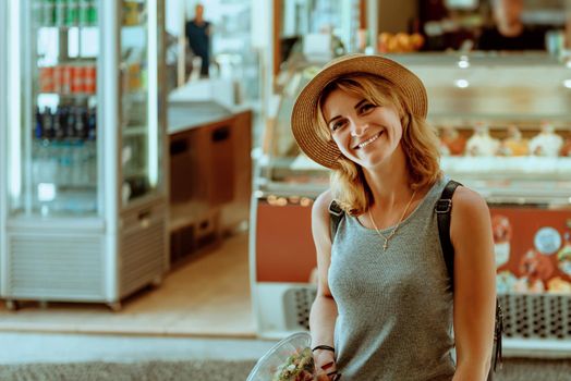 Tourist caucasian girl walking by old town. Boho girl walking on the city street