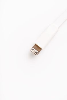 Connector lightning on a white background. This is a proprietary connector used to connect mobile devices to well-known host computers.