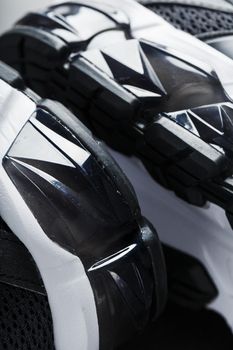Close-up of black and white gel cushioning sports shoe sole. Sports technology