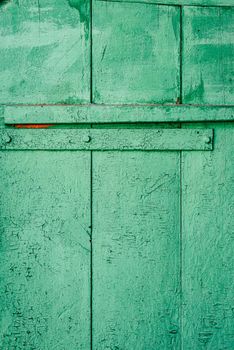 Background of green painted wooden surface. View from above