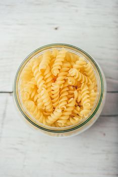Jar of Italian whole wheat fusilli pasta. View from above