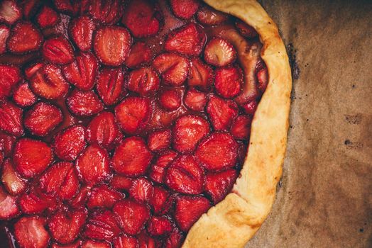 Close Up Of Fresh Baked Strawberry Galette On Baking Paper. View from Above