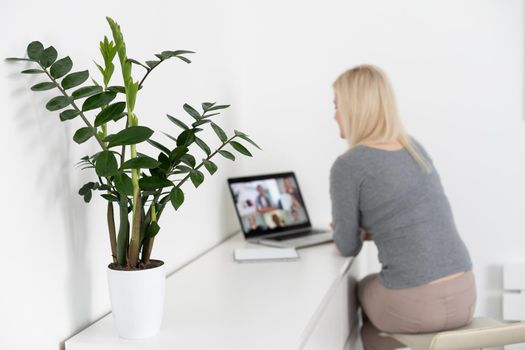 Woman Working From Home Having Group Videoconference On Laptop.