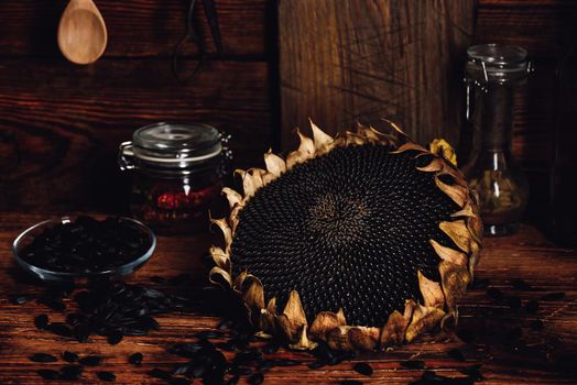 Dried sunflower and roasted seeds on the old wooden table