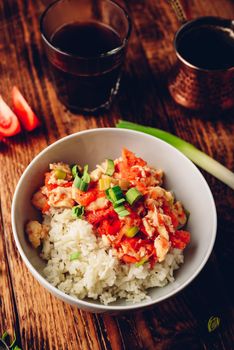 Scrambled eggs with tomatoes, leek and white rice. Turkish coffee and sliced ingredients.