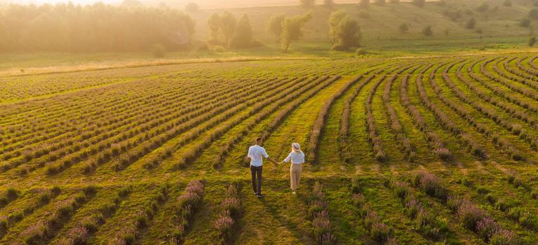 Young couple playing around in the lavender fields.