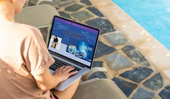 delivery icon on laptop keyboard. Online shopping, ecommerce and retail sale concept, delivery for customers ordering things from retailers websites using internet.