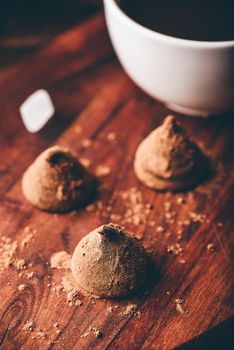 Homemade chocolate truffles coated with black coffee