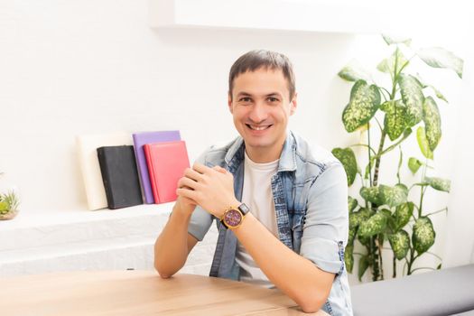 Attractive 30s caucasian businessman having online conversation using laptop at office desk