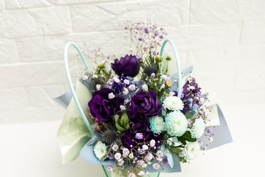 bouquet of purple and white flowers on white background