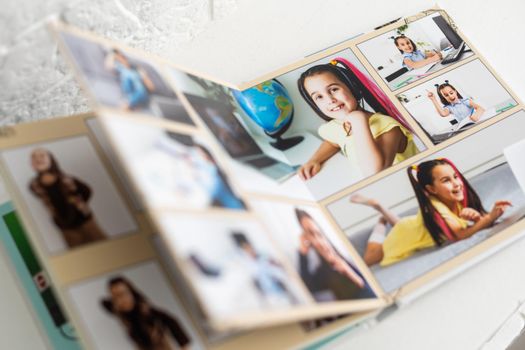 photobook of a little girl. Family, childhood and leisure concept.