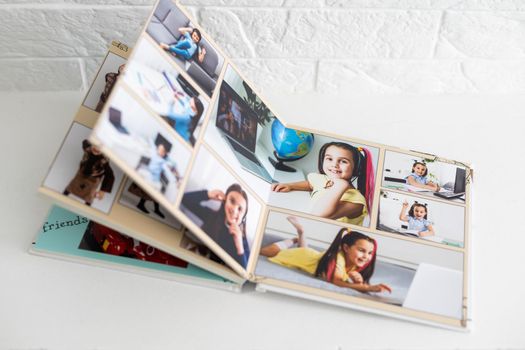 photobook of a little girl. Family, childhood and leisure concept.