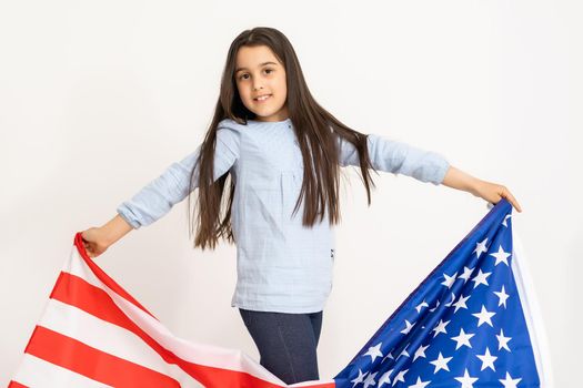 child holds a flag of America, USA