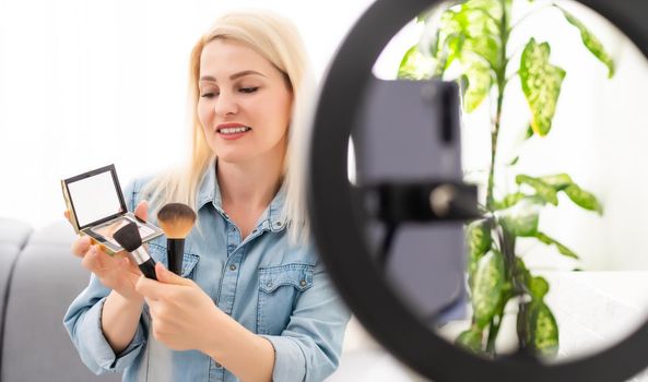 Female Vlogger Recording Broadcast At Home.