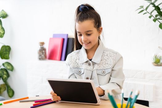 people, children and education concept - girl with tablet pc computer