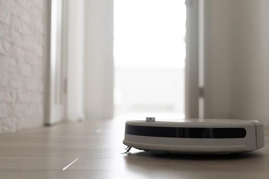 Robot Vacuum Cleaner In A Modern Living Room. High quality photo
