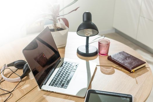 Laptop on table, home interior.