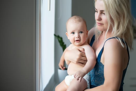 Portrait of happy mother and baby.