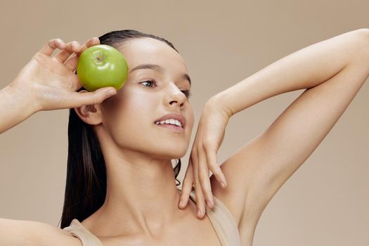 portrait woman apple in hands posing fruit healthy food fresh close-up Lifestyle. High quality photo