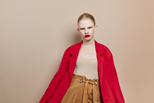 fashionable woman makeup in red jacket studio model unaltered. High quality photo