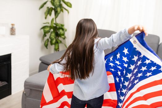 images of lovely little girl over USA flag background.